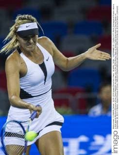 WUHAN, CHINA - SEPTEMBER 28: (CHINA OUT) Maria Sharapova of Russia returns a shot against Barbora Strycova of the Czech Republic during day two of the 2015 Wuhan Open at Optics Vally International Tennis Center on September 28, 2015 in Wuhan, Hubei Province of China.  CFP473572146 