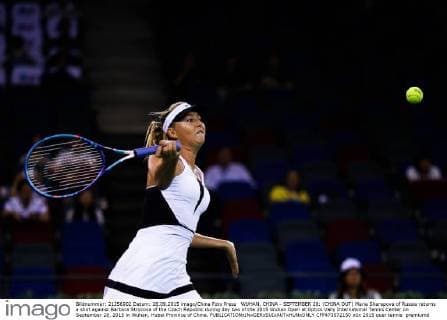 WUHAN, CHINA - SEPTEMBER 28: (CHINA OUT) Maria Sharapova of Russia returns a shot against Barbora Strycova of the Czech Republic during day two of the 2015 Wuhan Open at Optics Vally International Tennis Center on September 28, 2015 in Wuhan, Hubei Province of China.  CFP473572150 
