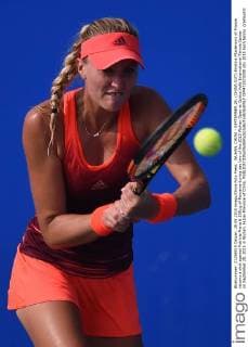 WUHAN, CHINA - SEPTEMBER 28: (CHINA OUT) Kristina Mladenovic of France returns a shot against Patricia Maria & 538;ig of Romania during day two of the 2015 Wuhan Open at Optics Vally International Tennis Center on September 28, 2015 in Wuhan, Hubei Province of China.  CFP473573208 