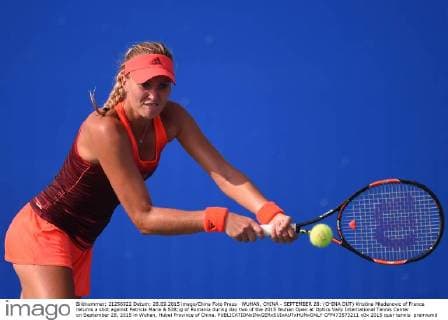 WUHAN, CHINA - SEPTEMBER 28: (CHINA OUT) Kristina Mladenovic of France returns a shot against Patricia Maria & 538;ig of Romania during day two of the 2015 Wuhan Open at Optics Vally International Tennis Center on September 28, 2015 in Wuhan, Hubei Province of China.  CFP473573211 