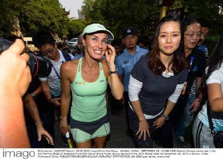 WUHAN, CHINA - SEPTEMBER 28: (CHINA OUT) Retired Chinese tennis star Li Na and Martina Hingis of Switzerland visit the Yellow Grane Tower during day two of the 2015 Wuhan Open on September 28, 2015 in Wuhan, Hubei Province of China.  CFP473573925 