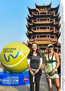 WUHAN, CHINA - SEPTEMBER 28: (CHINA OUT) Retired Chinese tennis star Li Na and Martina Hingis of Switzerland visit the Yellow Grane Tower during day two of the 2015 Wuhan Open on September 28, 2015 in Wuhan, Hubei Province of China.  CFP473573938 