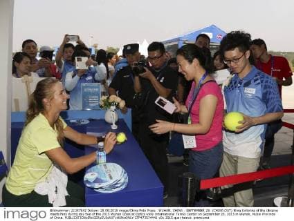 WUHAN, CHINA - SEPTEMBER 28: (CHINA OUT) Elina Svitolina of the Ukraine meets fans during day two of the 2015 Wuhan Open at Optics Vally International Tennis Center on September 28, 2015 in Wuhan, Hubei Province of China.  CFP473574441 
