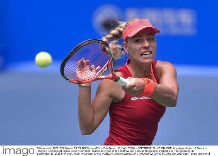 WUHAN, CHINA - SEPTEMBER 29: (CHINA OUT) Angelique Kerber of Germany returns a shot against Jelena Jankovic of Serbia during day three of the 2015 Wuhan Open at Optics Vally International Tennis Center on September 29, 2015 in Wuhan, Hubei Province of China.  CFP473602995 
