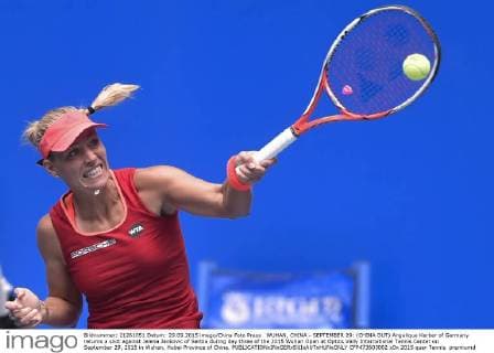 WUHAN, CHINA - SEPTEMBER 29: (CHINA OUT) Angelique Kerber of Germany returns a shot against Jelena Jankovic of Serbia during day three of the 2015 Wuhan Open at Optics Vally International Tennis Center on September 29, 2015 in Wuhan, Hubei Province of China.  CFP473603002 