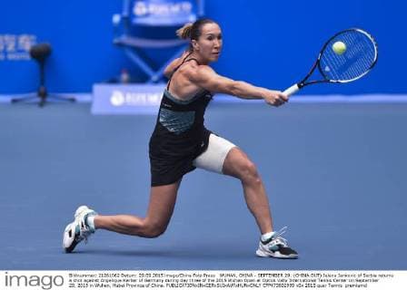 WUHAN, CHINA - SEPTEMBER 29: (CHINA OUT) Jelena Jankovic of Serbia returns a shot against Angelique Kerber of Germany during day three of the 2015 Wuhan Open at Optics Vally International Tennis Center on September 29, 2015 in Wuhan, Hubei Province of China.  CFP473602999 