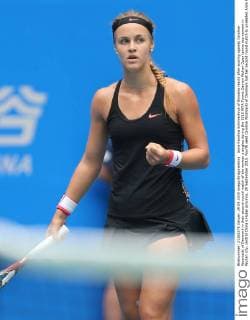 Anna Karolina Schmiedlova of Slovakia reacts after scoring against Caroline Wozniacki of Denmark in their second-round match of the women s singles during the 2015 WTA Tennis Damen Wuhan Open tennis tournament in Wuhan city, central China s Hubei province, 29 September 2015. Fourth seed Caroline Wozniacki of Denmark lost her second round match to unseeded Anna Karolina Schmiedlova of Slovakia 1-2 (6 1, 4 6, 6 7) in a marathon three hour match during the 2015 Wuhan Open on Tuesday (29 September 2015), further thinning out the ranks of the top seed players at the tournament. Fourth seed Wozniacki knocked out from Wuhan Open  20150929_34600