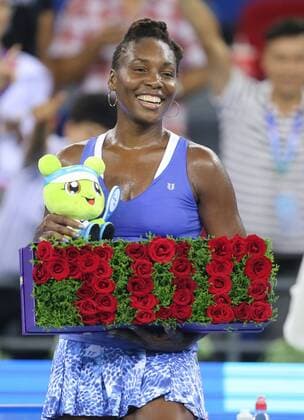 Venus Williams of the United States reacts as she celebrates the 700th victory of her career after defeating Julia Goerges of Germany in their second-round match of the women s singles during the 2015 WTA Tennis Damen Wuhan Open tennis tournament in Wuhan city, central China s Hubei province, 29 September 2015. Venus Williams earned the 700th victory of her career Tuesday (29 September 2015) by beating German qualifier Julia Goerges 6-4, 6-3 in the second round of Wuhan Open. Williams is a seven-time major champion who won her last Grand Slam title at Wimbledon in 2008. Venus Williams wins 700th match of career at Wuhan Open  20150929_35419