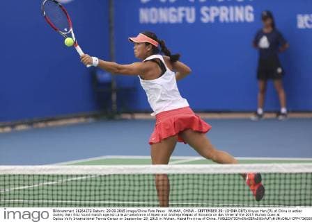 WUHAN, CHINA - SEPTEMBER 29: (CHINA OUT) Xinyun Han (R) of China in action during their first round match against Lara Arruabarrena of Spain and Andreja Klepac of Slovakia on day three of the 2015 Wuhan Open at Optics Vally International Tennis Center on September 29, 2015 in Wuhan, Hubei Province of China.  CFP473605052 