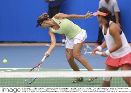 WUHAN, CHINA - SEPTEMBER 29: (CHINA OUT) Xinyun Han (R) of China and Nicole Melichar of America in action during their first round match against Lara Arruabarrena of Spain and Andreja Klepac of Slovakia on day three of the 2015 Wuhan Open at Optics Vally International Tennis Center on September 29, 2015 in Wuhan, Hubei Province of China.  CFP473605055 