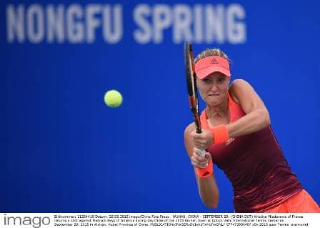 WUHAN, CHINA - SEPTEMBER 29: (CHINA OUT) Kristina Mladenovic of France returns a shot against Madison Keys of America during day three of the 2015 Wuhan Open at Optics Vally International Tennis Center on September 29, 2015 in Wuhan, Hubei Province of China.  CFP473606407 