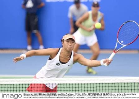 WUHAN, CHINA - SEPTEMBER 29: (CHINA OUT) Xinyun Han (L) of China and Nicole Melichar of America in action during their first round match against Lara Arruabarrena of Spain and Andreja Klepac of Slovakia on day three of the 2015 Wuhan Open at Optics Vally International Tennis Center on September 29, 2015 in Wuhan, Hubei Province of China.  CFP473605061 