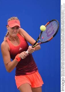 WUHAN, CHINA - SEPTEMBER 29: (CHINA OUT) Kristina Mladenovic of France returns a shot against Madison Keys of America during day three of the 2015 Wuhan Open at Optics Vally International Tennis Center on September 29, 2015 in Wuhan, Hubei Province of China.  CFP473606414 
