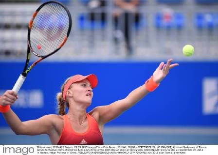 WUHAN, CHINA - SEPTEMBER 29: (CHINA OUT) Kristina Mladenovic of France serves to Madison Keys of America during day three of the 2015 Wuhan Open at Optics Vally International Tennis Center on September 29, 2015 in Wuhan, Hubei Province of China.  CFP473606416 