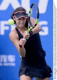 WUHAN, CHINA - SEPTEMBER 29: (CHINA OUT) Caroline Garcia of France returns a shot against Coco Vandeweghe of America during day three of the 2015 Wuhan Open at Optics Vally International Tennis Center on September 29, 2015 in Wuhan, Hubei Province of China.  CFP473610648 