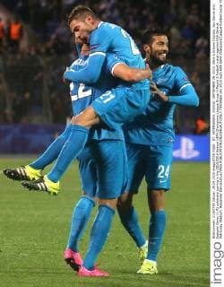 ST. PETERSBURG, RUSSIA. SEPTEMBER 29, 2015. Zenit s Artyom Dzyuba, Javi Garcia and Ezequiel Garay (L-R) celebrate scoring in the 2015 2016 Season UEFA Champions League Group H Round 2 football match against KAA Gent at Petrovsky Stadium. Alexander Demianchuk TASS  TS00EB65