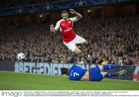 29.09.2015. London, England. Champions League. Arsenal versus Olympiakos. Arsenal s Kieran Gibbs is sent flying into the air after the challenge by Alberto Bot& xed;a of Olympiakos. xNigelxCookex  ActionPlus11666307