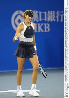 Garbine Muguruza of Spain reacts after defeating Ana Ivanovic of Serbia in their third-round match of the women s singles during the 2015 WTA Tennis Damen Wuhan Open tennis tournament in Wuhan city, central China s Hubei province, 30 September 2015. Garbine Muguruza defeated Ana Ivanovic 2-1 (4 6, 6 1, 6 0). Muguruza eliminates Ivanovic at Wuhan Open  pbu338844_11