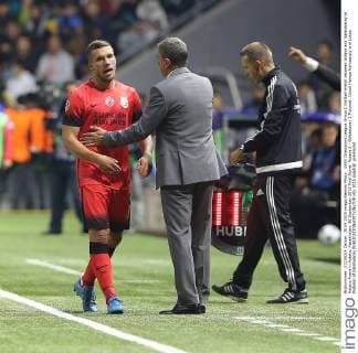 UEFA Champions League Group C football match between Astana and Galatasaray at Astana Arena in Astana, Kazakhstan, 30 September 2015 Final Score: Astana 2 - Galatasaray 2 Pictured: Coach Hamza Hamzaoglu and Lukas Podolski of Galatasaray 