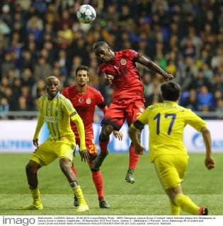 UEFA Champions League Group C football match between Astana and Galatasaray at Astana Arena in Astana, Kazakhstan, 30 September 2015 Final Score: Astana 2 - Galatasaray 2 Pictured: Junior Kabananga 89 of Astana and Lionel Carole and Hakan Balta of Galatasaray 
