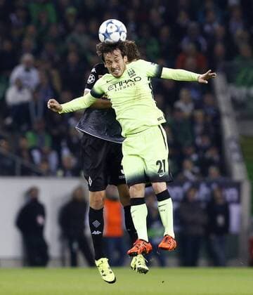Andreas Christensen (Bor. Mönchengladbach) (L) jumps for a header against David Silva (Manchester City) during the Championsleague between Borussia Moenchengladbach and Manchester City, Borussiapark in Moenchengladbach on September 30., 2015. Borussia Mönchengladbach vs. Manchester City in der Champions League der Saison 2015 2016 am 30. September 2015.