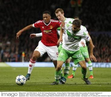 Anthony Martial of Manchester United ManU tussles with Ricardo Rodriguez of Wolfsburg - UEFA Champions League - Group B - Manchester Utd vs Vfl Wolfsburg - Old Trafford Stadium - Manchester - England - 30th September 2015 - Picture Simon Bellis Sportimage EDITORIAL USE ONLY. No use with unauthorised audio, video, data, fixture lists, club league logos or live services. Online in-match use limited to 120 images, no video emulation. No use in betting, games or single club league player publications.