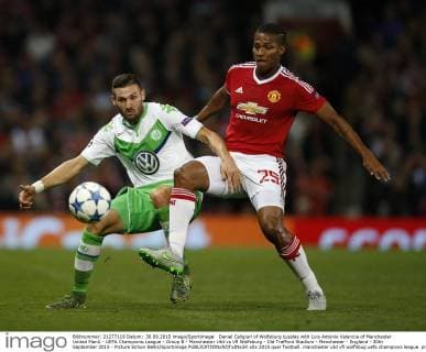 Daniel Caligiuri of Wolfsburg tussles with Luis Antonio Valencia of Manchester United ManU - UEFA Champions League - Group B - Manchester Utd vs Vfl Wolfsburg - Old Trafford Stadium - Manchester - England - 30th September 2015 - Picture Simon Bellis Sportimage EDITORIAL USE ONLY. No use with unauthorised audio, video, data, fixture lists, club league logos or live services. Online in-match use limited to 120 images, no video emulation. No use in betting, games or single club league player publications.