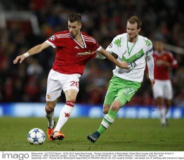 Morgan Schneiderlin of Manchester United ManU tussles with Maximilian Arnold of Wolfsburg - UEFA Champions League - Group B - Manchester Utd vs Vfl Wolfsburg - Old Trafford Stadium - Manchester - England - 30th September 2015 - Picture Simon Bellis Sportimage EDITORIAL USE ONLY. No use with unauthorised audio, video, data, fixture lists, club league logos or live services. Online in-match use limited to 120 images, no video emulation. No use in betting, games or single club league player publications.