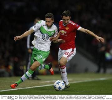 Julian Draxler of Wolfsburg and Matteo Darmian of Manchester United ManU tussle it out - UEFA Champions League - Group B - Manchester Utd vs Vfl Wolfsburg - Old Trafford Stadium - Manchester - England - 30th September 2015 - Picture Simon Bellis Sportimage EDITORIAL USE ONLY. No use with unauthorised audio, video, data, fixture lists, club league logos or live services. Online in-match use limited to 120 images, no video emulation. No use in betting, games or single club league player publications.