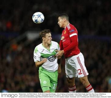Chris Smalling of Manchester United ManU heads clear from Max Kruse of Wolfsburg - UEFA Champions League - Group B - Manchester Utd vs Vfl Wolfsburg - Old Trafford Stadium - Manchester - England - 30th September 2015 - Picture Simon Bellis Sportimage EDITORIAL USE ONLY. No use with unauthorised audio, video, data, fixture lists, club league logos or live services. Online in-match use limited to 120 images, no video emulation. No use in betting, games or single club league player publications.