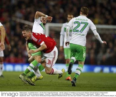 Daniel Caligiuri of Wolfsburg brings down Bastian Schweinsteiger of Manchester United ManU - UEFA Champions League - Group B - Manchester Utd vs Vfl Wolfsburg - Old Trafford Stadium - Manchester - England - 30th September 2015 - Picture Simon Bellis Sportimage EDITORIAL USE ONLY. No use with unauthorised audio, video, data, fixture lists, club league logos or live services. Online in-match use limited to 120 images, no video emulation. No use in betting, games or single club league player publications.