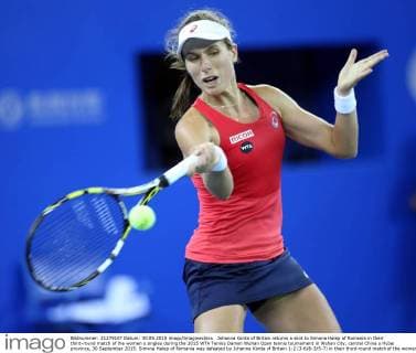 Johanna Konta of Britain returns a shot to Simona Halep of Romania in their third-round match of the women s singles during the 2015 WTA Tennis Damen Wuhan Open tennis tournament in Wuhan city, central China s Hubei province, 30 September 2015. Simona Halep of Romania was defeated by Johanna Konta of Britain 1-2 (3-6 6-3 5-7) in their third-round match of the women s singles during the 2015 WTA Wuhan Open tennis tournament in Wuhan city, central China s Hubei province, 30 September 2015. Top seed Simona Halep ousted by Johanna Konta at Wuhan Open  20150930_66473