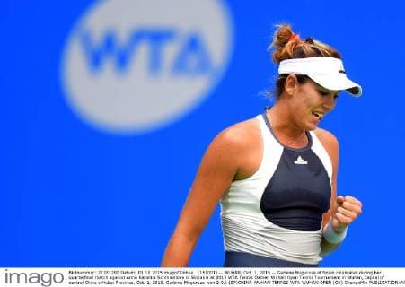 (151001) -- WUHAN, Oct. 1, 2015 -- Garbine Muguruza of Spain celebrates during her quarterfinal match against Anna Karolina Schmiedlova of Slovakia at 2015 WTA Tennis Damen Wuhan Open Tennis Tournament in Wuhan, capital of central China s Hubei Province, Oct. 1, 2015. Garbine Muguruza won 2-0.) (SP)CHINA-WUHAN-TENNIS-WTA-WUHAN OPEN (CN) ChengxMin 