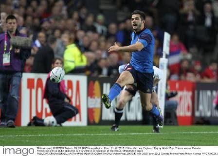 01.10.2015. Milton Keynes, England. Rugby World Cup. France versus Canada. French wing Brice Dulin kicks the ball forward in anticipation of the chase. xPhilxHutchinsonx  ActionPlus11667143