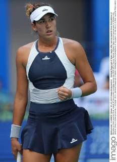 Garbine Muguruza of Spain reacts after scoring against Anna Schmiedlova of Slovakia in their quarter-final match of the women s singles during the 2015 WTA Tennis Damen Wuhan Open tennis tournament in Wuhan city, central China s Hubei province, 1 October 2015. Garbine Muguruza of Spain defeated Anna Schmiedlova of Slovakia 2-0 (6-2 6-2) in their quarter-final match of the women s singles during the 2015 WTA Wuhan Open tennis tournament in Wuhan city, central China s Hubei province, on Thursday (1 October 2015). Garbine Muguruza beats Anna Schmiedlova to advance at Wuhan Open  pbu339413_02
