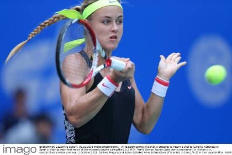 Anna Schmiedlova of Slovakia prepares to return a shot to Garbine Muguruza of Spain in their quarter-final match of the women s singles during the 2015 WTA Tennis Damen Wuhan Open tennis tournament in Wuhan city, central China s Hubei province, 1 October 2015. Garbine Muguruza of Spain defeated Anna Schmiedlova of Slovakia 2-0 (6-2 6-2) in their quarter-final match of the women s singles during the 2015 WTA Wuhan Open tennis tournament in Wuhan city, central China s Hubei province, on Thursday (1 October 2015). Garbine Muguruza beats Anna Schmiedlova to advance at Wuhan Open  pbu339413_03