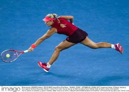 WUHAN, CHINA - OCTOBER 02: (CHINA OUT) Angelique Kerber of Russia returns a shot against Garbine Muguruza of Spain in semi-final match during day six of 2015 Dongfeng Motor Wuhan Open at Optics Valley International Tennis Center on October 2, 2015 in Wuhan, Hubei Province of China.  CFP473769728 