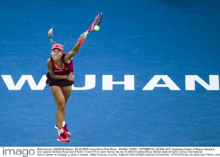 WUHAN, CHINA - OCTOBER 02: (CHINA OUT) Angelique Kerber of Russia returns a shot against Garbine Muguruza of Spain in semi-final match during day six of 2015 Dongfeng Motor Wuhan Open at Optics Valley International Tennis Center on October 2, 2015 in Wuhan, Hubei Province of China.  CFP473769722 