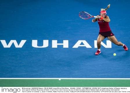 WUHAN, CHINA - OCTOBER 02: (CHINA OUT) Angelique Kerber of Russia returns a shot against Garbine Muguruza of Spain in semi-final match during day six of 2015 Dongfeng Motor Wuhan Open at Optics Valley International Tennis Center on October 2, 2015 in Wuhan, Hubei Province of China.  CFP473769726 