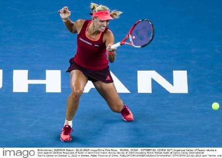 WUHAN, CHINA - OCTOBER 02: (CHINA OUT) Angelique Kerber of Russia returns a shot against Garbine Muguruza of Spain in semi-final match during day six of 2015 Dongfeng Motor Wuhan Open at Optics Valley International Tennis Center on October 2, 2015 in Wuhan, Hubei Province of China.  CFP473769723 