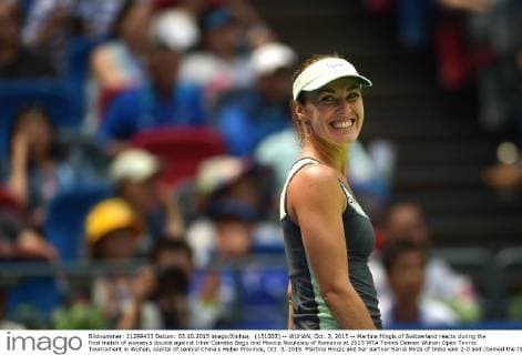 (151003) -- WUHAN, Oct. 3, 2015 -- Martina Hingis of Switzerland reacts during the final match of women s double against Irina-Camelia Begu and Monica Niculescu of Romania at 2015 WTA Tennis Damen Wuhan Open Tennis Tournament in Wuhan, capital of central China s Hubei Province, Oct. 3, 2015. Martina Hingis and her partner Sania Mirza of India won 2-0 and claimed the title. ) (SP)CHINA-WUHAN-TENNIS-WTA-WUHAN OPEN (CN) ChengxMin 
