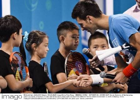 BEIJING, CHINA - OCTOBER 03: (CHINA OUT) Novak Djokovic of Serbia takes part in a charity promotion on day one of the 2015 China Open at the China National Tennis Centre on October 3, 2015 in Beijing, China.  CFP473807856 