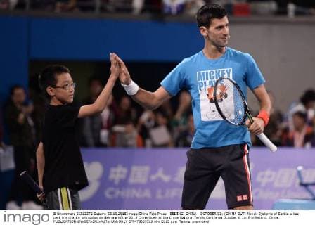 BEIJING, CHINA - OCTOBER 03: (CHINA OUT) Novak Djokovic of Serbia takes part in a charity promotion on day one of the 2015 China Open at the China National Tennis Centre on October 3, 2015 in Beijing, China.  CFP473809519 