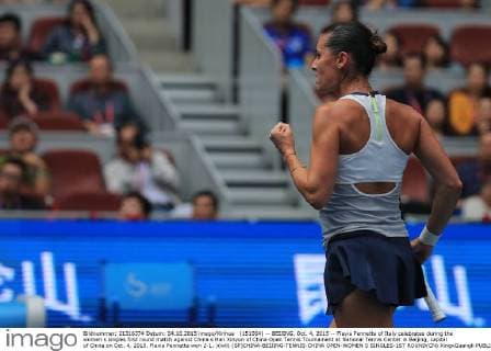 (151004) -- BEIJING, Oct. 4, 2015 -- Flavia Pennetta of Italy celebrates during the women s singles first round match against China s Han Xinyun of China Open Tennis Tournament at National Tennis Center in Beijing, capital of China on Oct. 4, 2015. Flavia Pennetta won 2-1. )(wll) (SP)CHINA-BEIJING-TENNIS-CHINA OPEN-WOMEN S SINGLES-1ST ROUND(CN) XingxGuangli 