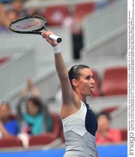 (151004) -- BEIJING, Oct. 4, 2015 -- Flavia Pennetta of Italy reacts after the women s singles first round match against China s Han Xinyun of China Open Tennis Tournament at National Tennis Center in Beijing, capital of China on Oct. 4, 2015. Flavia Pennetta won 2-1. )(wll) (Correction)(SP)CHINA-BEIJING-TENNIS-CHINA OPEN-WOMEN S SINGLES-1ST ROUND(CN) LixWen 