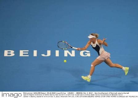 (151004) -- BEIJING, Oct. 4, 2015 -- Caroline Wozniacki of Denmark returns the ball against Bojana Jovanovski of Serbia during their women s singles first round match of China Open Tennis Tournament at National Tennis Center in Beijing, capital of China on Oct. 4, 2015. Wozniacki won 2-0. )(wll) (SP)CHINA-BEIJING-TENNIS-CHINA OPEN-WOMEN S SINGLES-1ST ROUND(CN) XingxGuangli 
