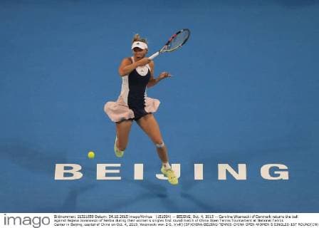 (151004) -- BEIJING, Oct. 4, 2015 -- Caroline Wozniacki of Denmark returns the ball against Bojana Jovanovski of Serbia during their women s singles first round match of China Open Tennis Tournament at National Tennis Center in Beijing, capital of China on Oct. 4, 2015. Wozniacki won 2-0. )(wll) (SP)CHINA-BEIJING-TENNIS-CHINA OPEN-WOMEN S SINGLES-1ST ROUND(CN) XingxGuangli 