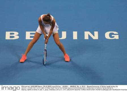 (151004) -- BEIJING, Oct. 4, 2015 -- Bojana Jovanovski of Serbia reacts during the women s singles first round match of China Open Tennis Tournament against Caroline Wozniacki of Denmark at National Tennis Center in Beijing, capital of China on Oct. 4, 2015. Wozniacki won 2-0. )(wll) (SP)CHINA-BEIJING-TENNIS-CHINA OPEN-WOMEN S SINGLES-1ST ROUND(CN) XingxGuangli 