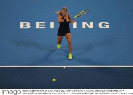 (151005) -- BEIJING, Oct. 5, 2015 -- Dominika Cibulkova of Slovak Republic returns the ball during the women s singles first round match of China Open Tennis Tournament against Jelena Jankovic of Serbia at National Tennis Center in Beijing, capital of China on Oct. 4, 2015. Cibulkova won 2-1. ) (SP)CHINA-BEIJING-TENNIS-CHINA OPEN-WOMEN S SINGLES-1ST ROUND(CN) XingxGuangli 