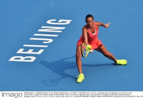 (151005) -- BEIJING, Oct. 5, 2015 -- Roberta Vinci of Italy returns the shot during her women s singles first round match of China Open Tennis Tournament against Alison Van Uytvanck of Belgium at National Tennis Center in Beijing, capital of China on Oct. 5, 2015. Roberta Vinci won 2-0. ) (SP)CHINA-BEIJING-TENNIS-CHINA OPEN-WOMEN S SINGLES-1ST ROUND(CN) LixWen 